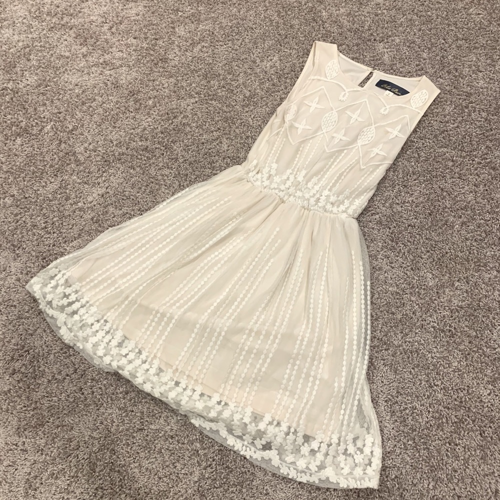 White, sheer detailed dress with attached sheath.